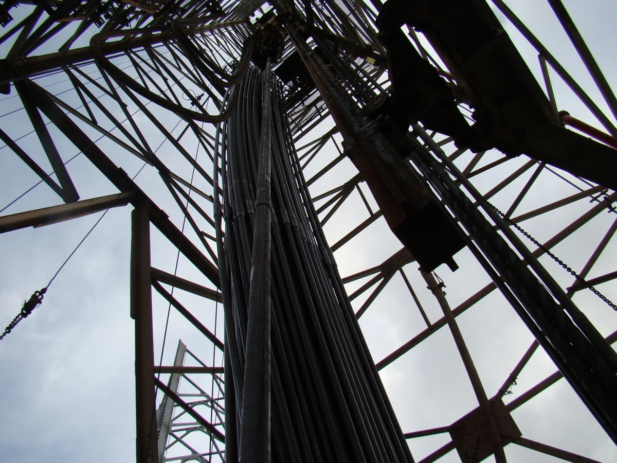 Looking up through the steel structure of a drilling derrick